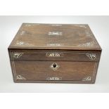 A Victorian rosewood vanity box, with inlaid foliate mother of pearl decoration, the hinged cover op