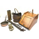 An Edwardian walnut coal scuttle, with shovel, D47cm, together with a copper coal scuttle, a cast br