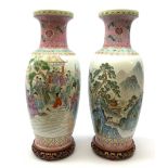 A pair of large Chinese famile rose style vases, one decorated with figural scene, the other with mo