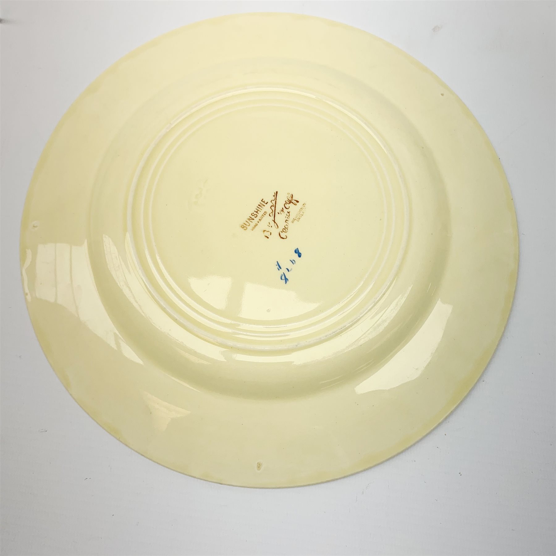 A Clarice Cliff Bizarre by Wilkinson Limited dinner plate, trio and cup in the Sunshine pattern. (5) - Image 4 of 4