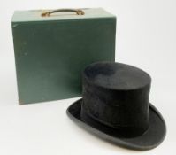 A Vintage black Dunn & Co London top hat, interior circumference measures approximately 58cm, with