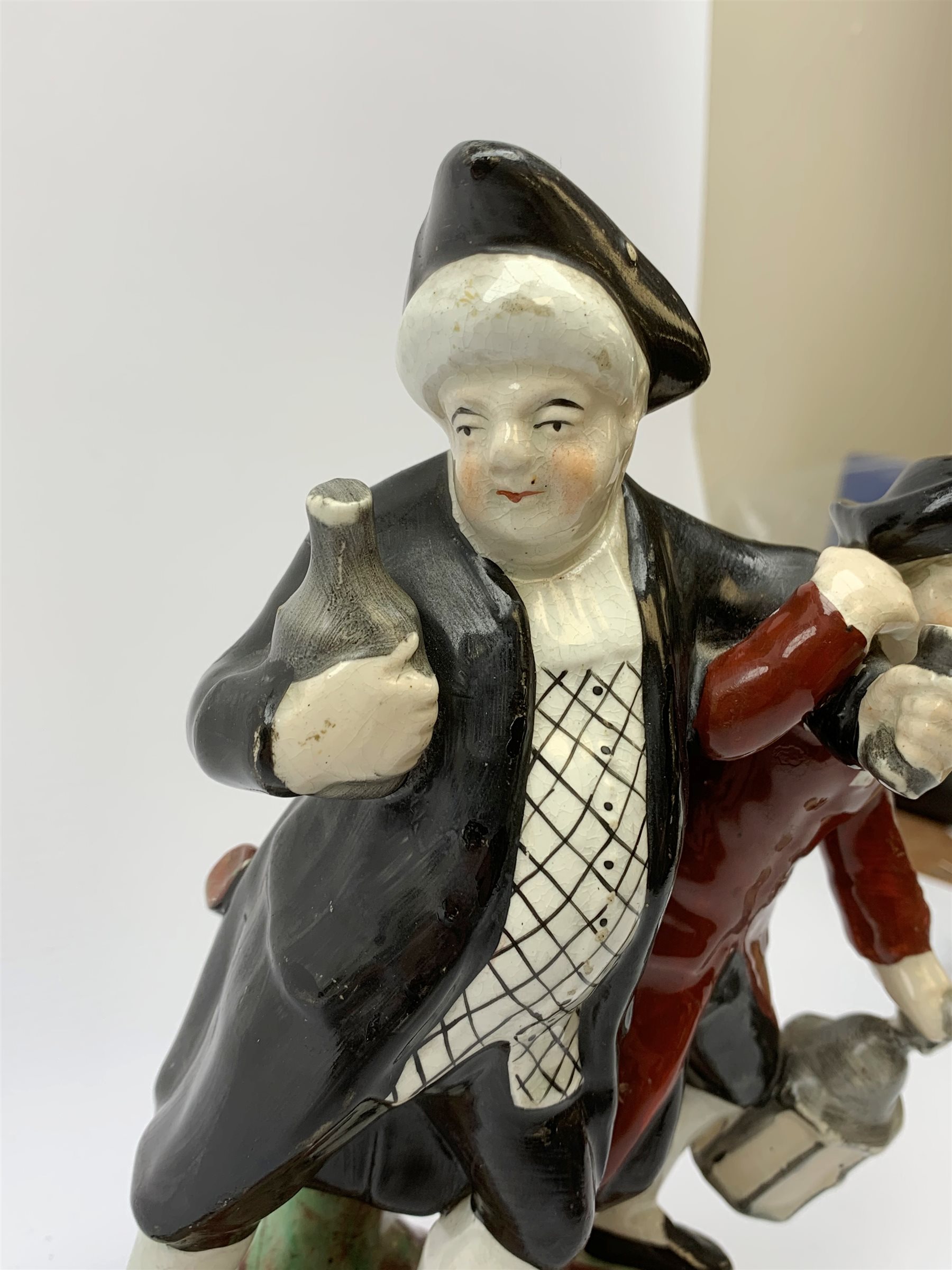 A 19th century Staffordshire figure group, 'Town Crier and Drunk', upon oval scroll detailed base, H - Image 6 of 8