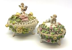 A Schierholz porcelain pot pourri basket and cover, c.1900, the pierced body raised upon three scrol