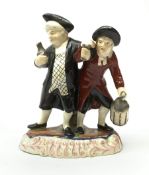 A 19th century Staffordshire figure group, 'Town Crier and Drunk', upon oval scroll detailed base, H