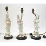 Three blanc de chine figures, modelled as Guanyin, each mounted upon a lamp base, (a/f), figures H26