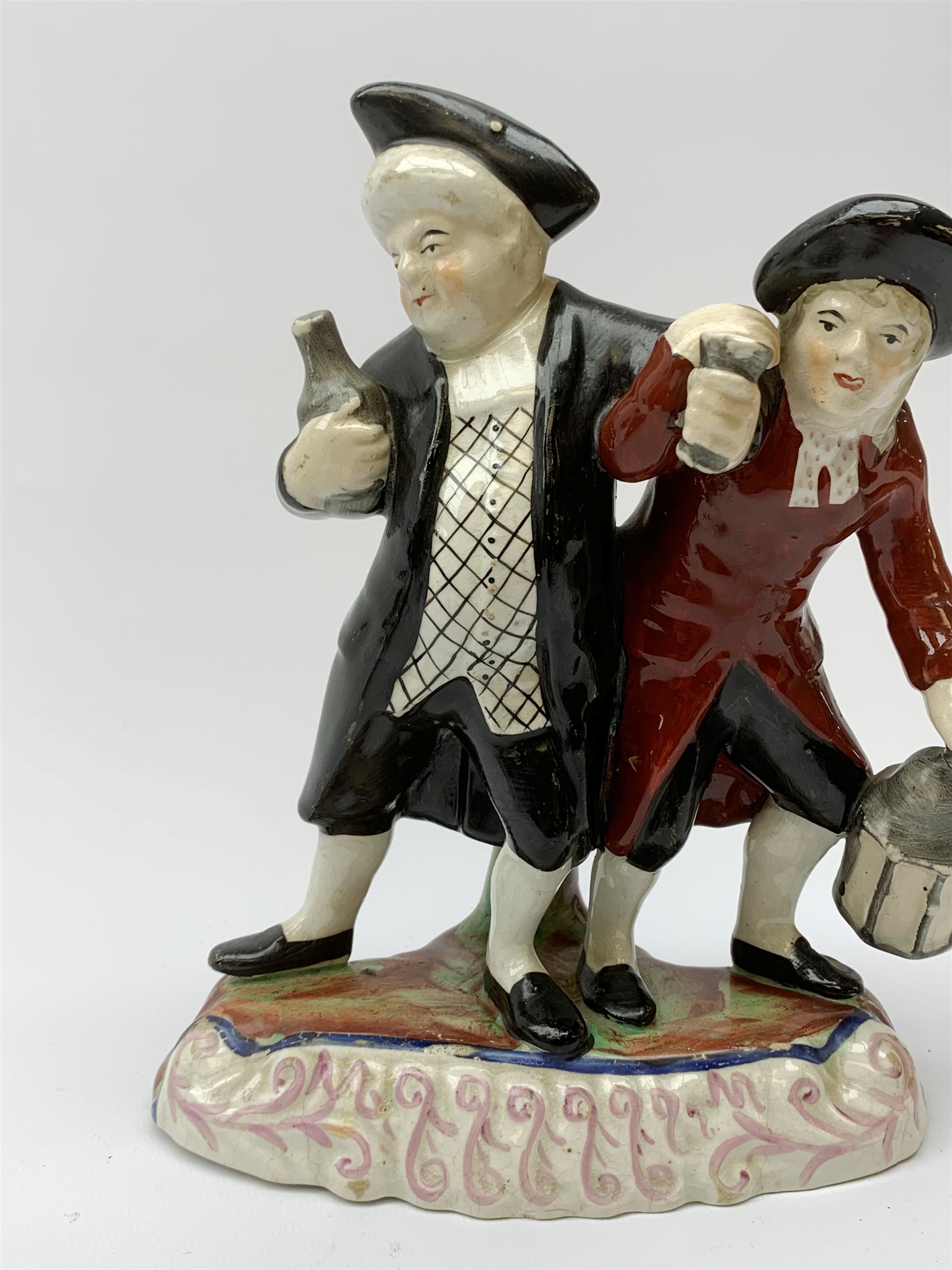 A 19th century Staffordshire figure group, 'Town Crier and Drunk', upon oval scroll detailed base, H - Image 5 of 8