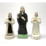 Three 19th century Staffordshire pottery figures, each modelled as John Wesley, largest H20.5cm.