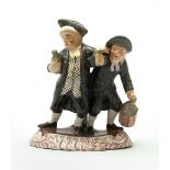 A 19th century Staffordshire figure group, 'Town Crier and Drunk', upon oval scroll detailed base, H