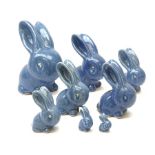 A collection of eight Denby blue glazed models of the Rabbits Marmaduke and Cotton tail, various siz
