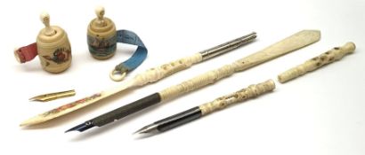Two Victorian bone Stanhope pens with letter opener terminals, together with two further bone Stanho