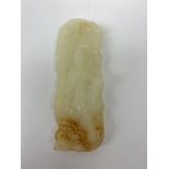 A white Hetian and russet carved jade buddha, H9.5cm.