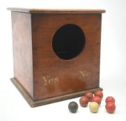 A Victorian mahogany ballot box, detailed Yes and No, H25cm, with six red, one black, and one white