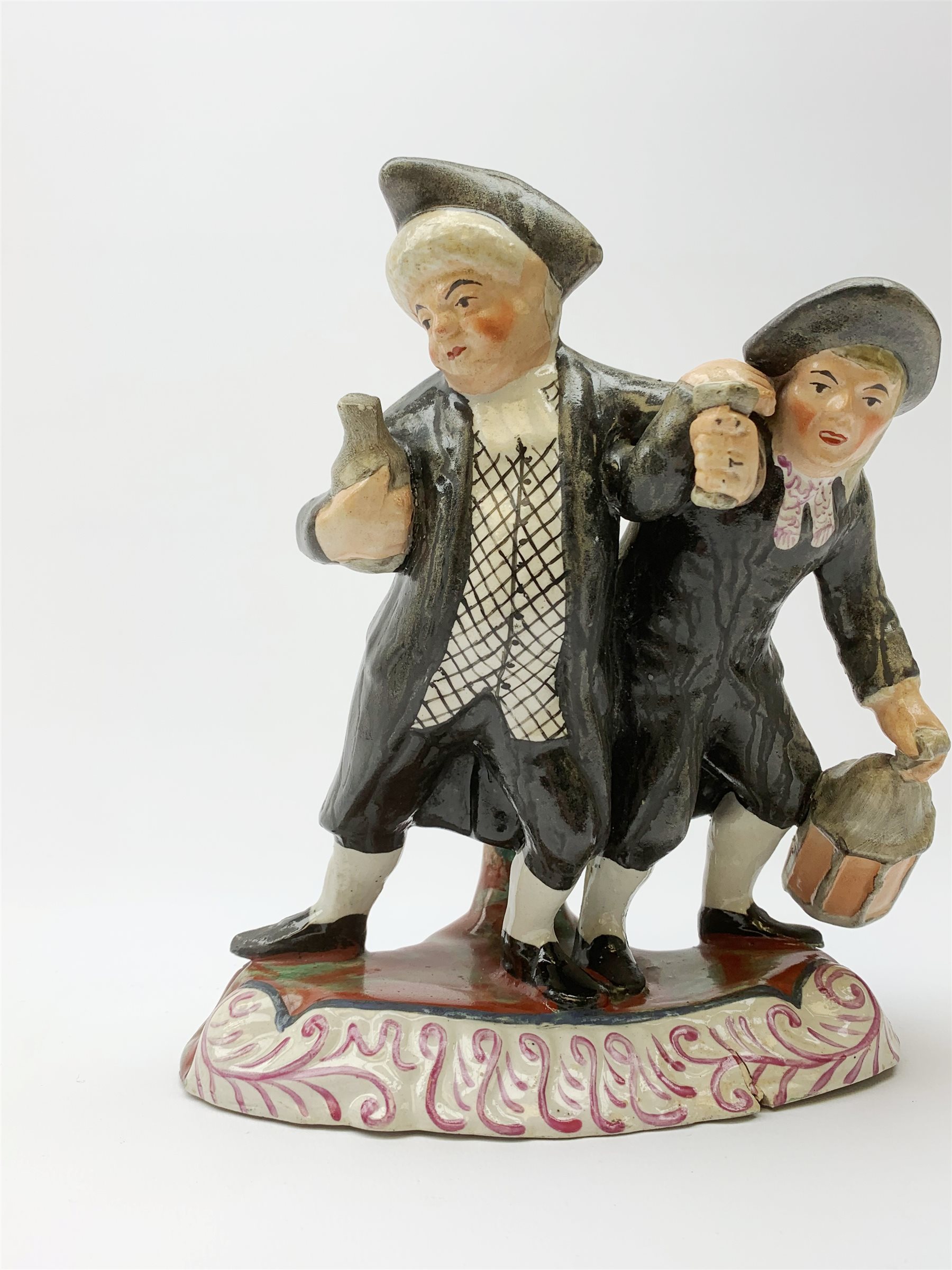 A 19th century Staffordshire figure group, 'Town Crier and Drunk', upon oval scroll detailed base, H - Image 2 of 7