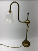A brass students lamp, with adjustable swan neck and crackle effect clear glass frilled shade, H70cm