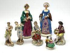Four Sitzendorf figurines, comprising two examples modelled as two of Henry VIII's wives, a smaller