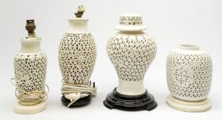 Four Chinese reticulated or pierced white glazed lamp bases, (two without fittings), largest H30cm.