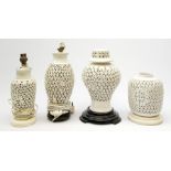 Four Chinese reticulated or pierced white glazed lamp bases, (two without fittings), largest H30cm.