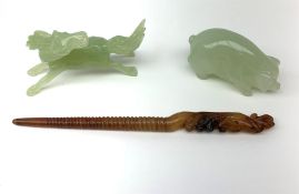 A carved jade pig, L6.5cm, together with a carved jade horse, L10cm, and a russet jade hair pin with