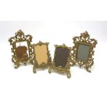 A pair of 19th century gilt metal rococo style frames, H29cm, together with two smaller later exampl