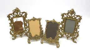 A pair of 19th century gilt metal rococo style frames, H29cm, together with two smaller later exampl