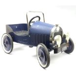 A blue painted metal pedal car, modelled as a 1930s motor vehicle, with a moulded plastic seat, sing