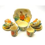 A Grays Pottery tea set, hand painted with flowers in tones of orange, yellow and green, comprising