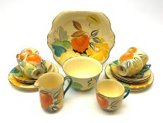 A Grays Pottery tea set, hand painted with flowers in tones of orange, yellow and green, comprising
