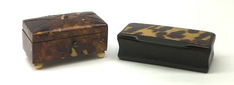 A 19th century tortoiseshell snuff box, with strung detail to the hinged cover, raised upon four ivo