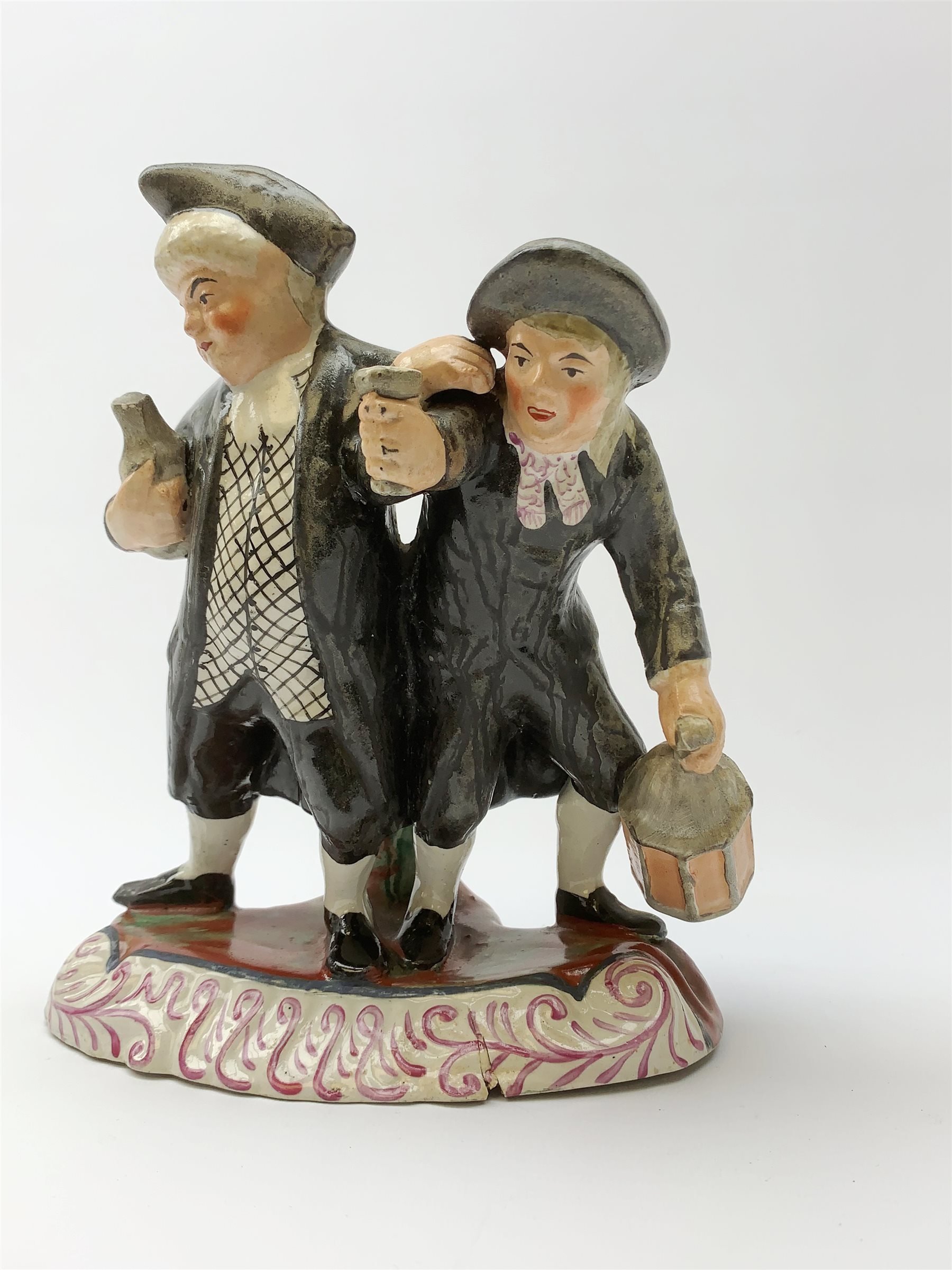 A 19th century Staffordshire figure group, 'Town Crier and Drunk', upon oval scroll detailed base, H - Image 3 of 7