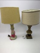 A turned wooden lamp base, with cream shade, overall H53cm, together with another wooden lamp base,