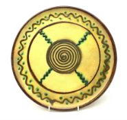 Vallauris Pottery wall plate or small charger, of circular form, the yellow ground with stylised dec