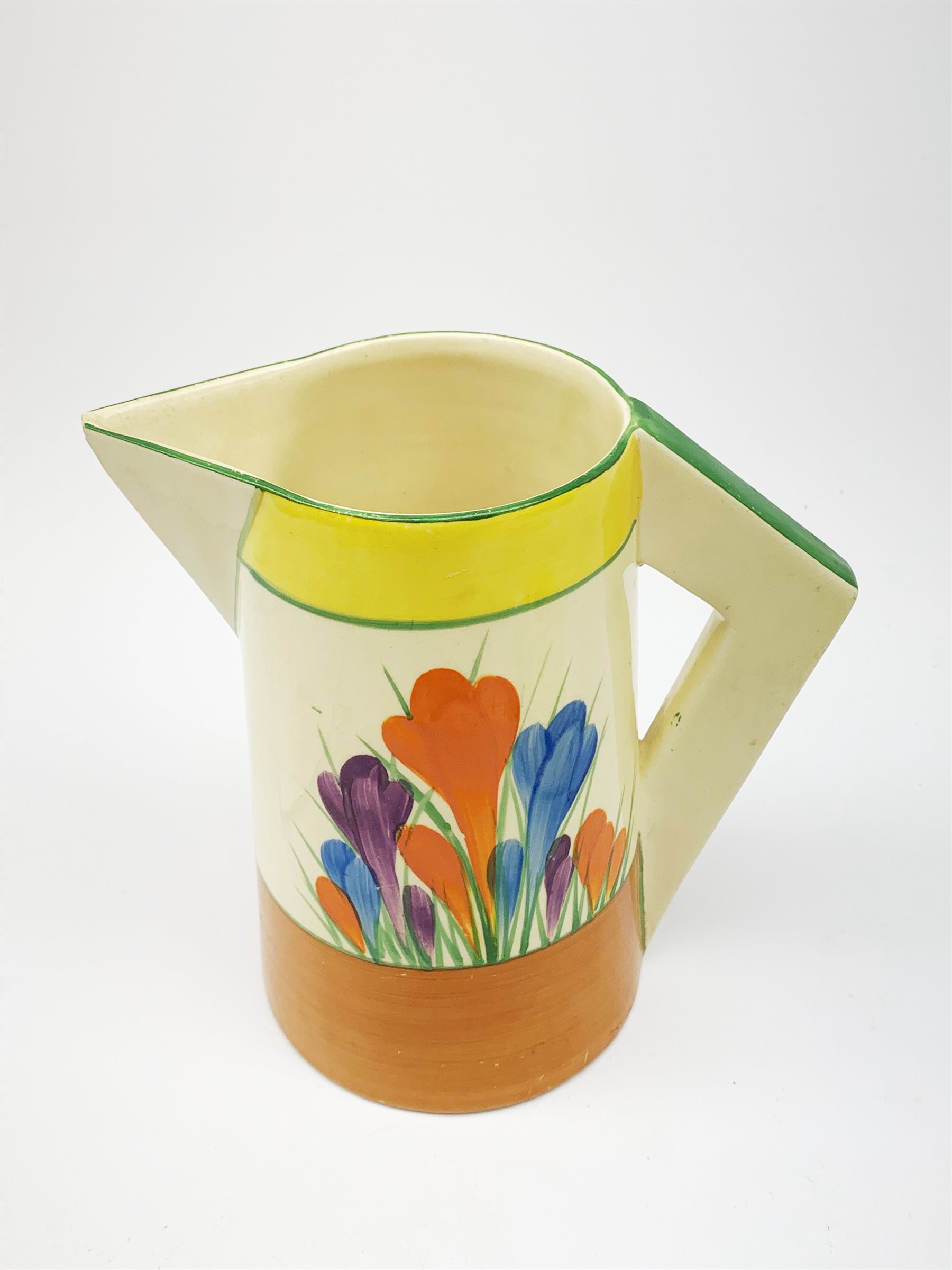 A Clarice Cliff Newport Pottery jug, decorated in the Crocus pattern, H16.5cm, together with a Clari - Image 2 of 3