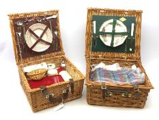 A wicker Amberley picnic basket, together with a wicker Optima example, each with contents. (2).