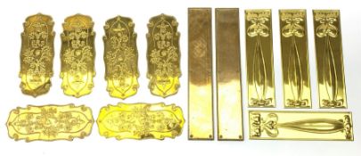 A group of brass door finger plates, comprising four Art Nouveau examples, H28cm, six with scroll ed