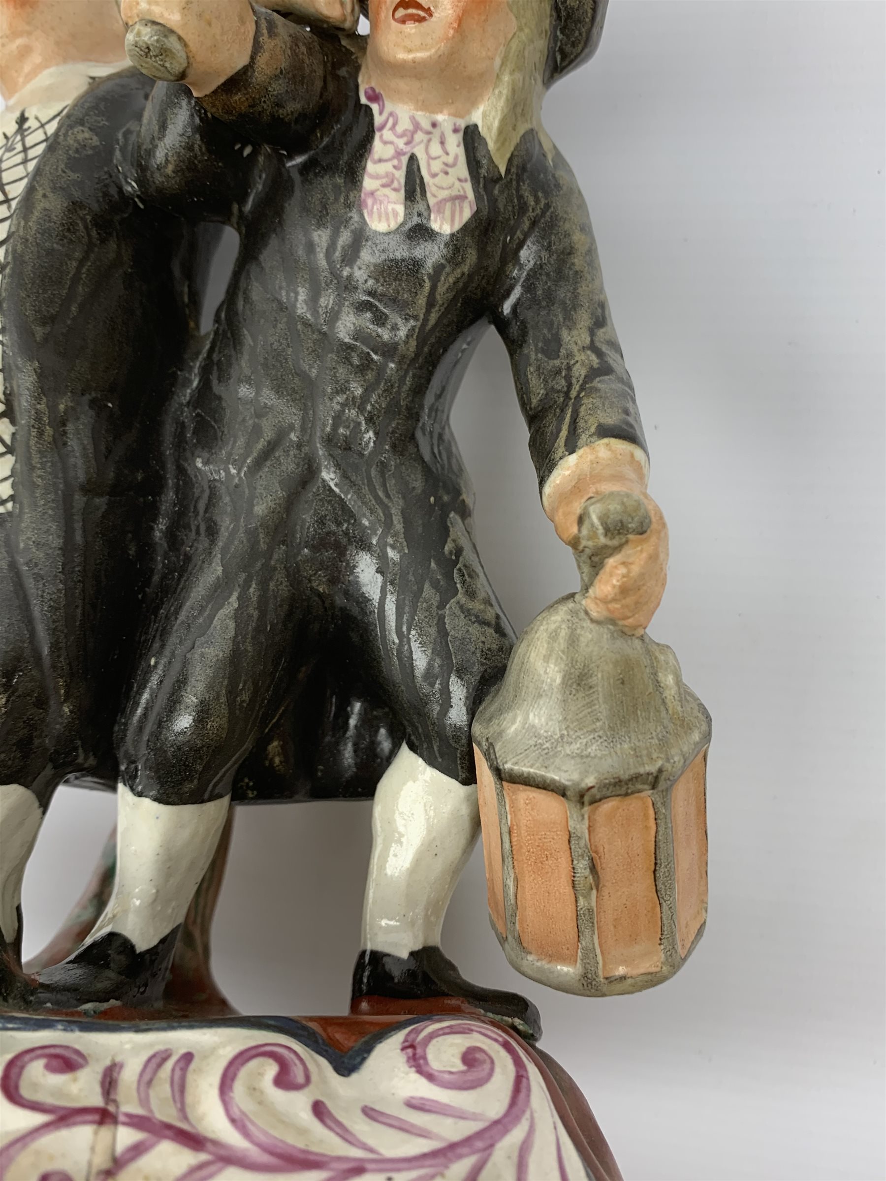 A 19th century Staffordshire figure group, 'Town Crier and Drunk', upon oval scroll detailed base, H - Image 6 of 7