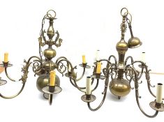 Two brass Flemish style chandeliers, each with six curved branches detailed with fish, largest H63cm