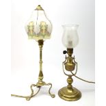Two brass table lamps, one example with Art Nouveau decoration to the glass shade, H49cm.