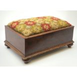 A Victorian mahogany foot stool, of rectangular form with four turned feet and Berlin wool work styl