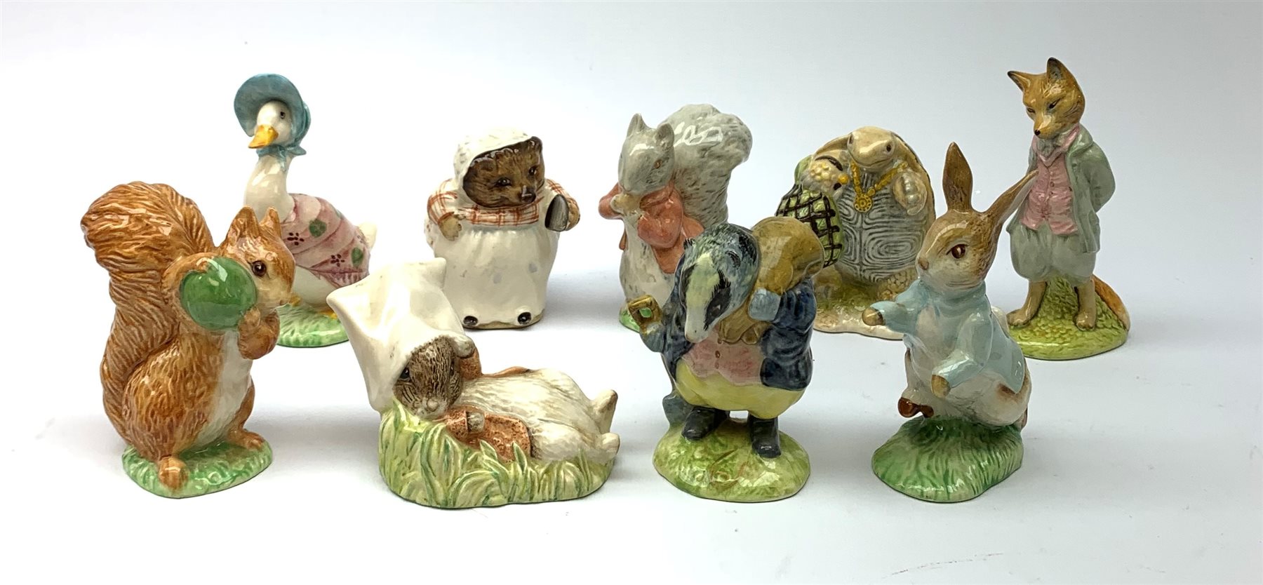 Five Beswick Beatrix Potter figurines, comprising Tommy Brock, Mrs Tiggy Winkle, Jemima Puddleduck,