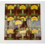 Ten Art Nouveau tiles, each decorated with stylised yellow and green flowers upon a brown ground,15c