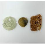 Two Russet carved jade pendants, one with zoomorphic detail, the other with floral detail, largest H