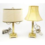 Two gilt table lamps, each with column modelled stem and shade, largest including shade H49cm.