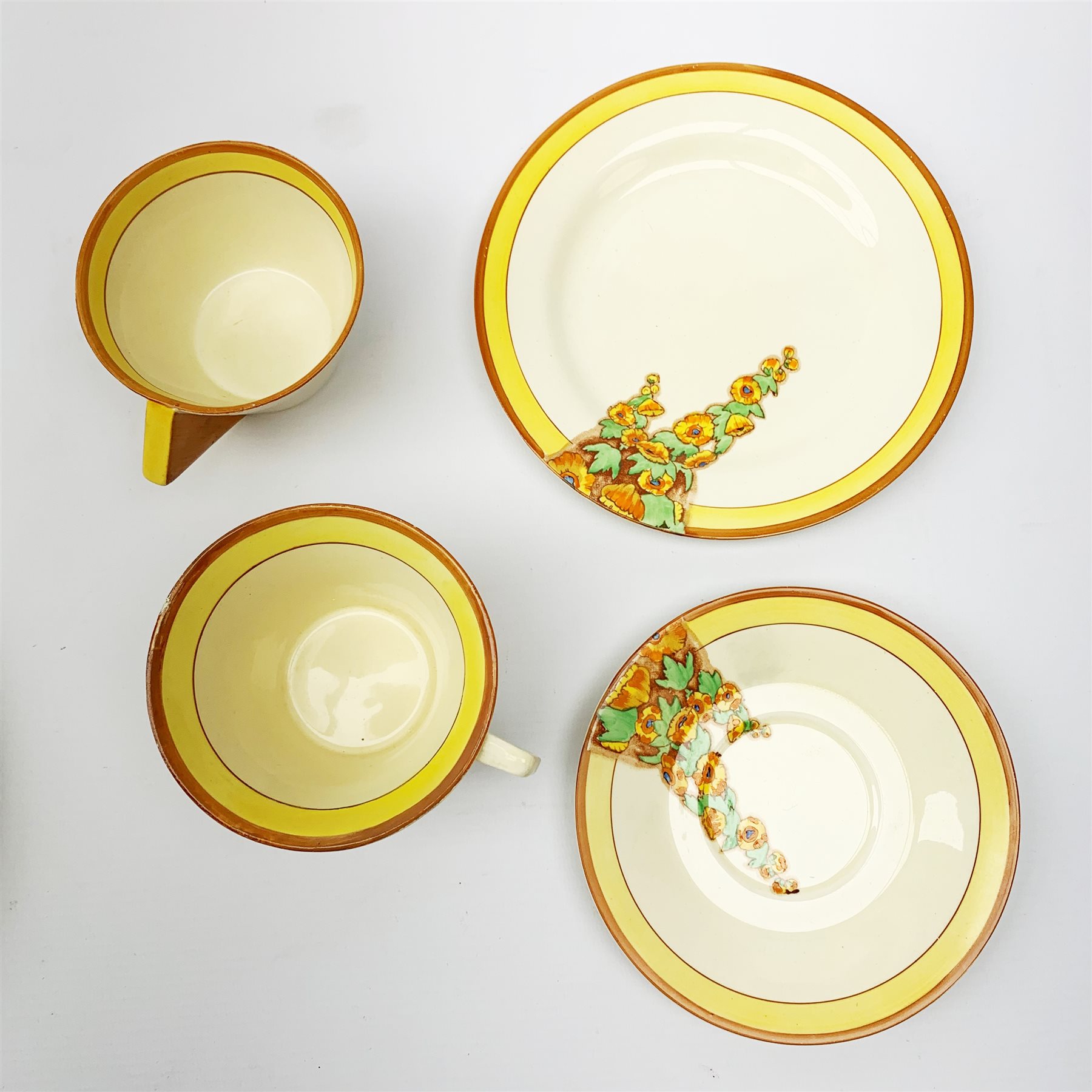 A Clarice Cliff Bizarre by Wilkinson Limited dinner plate, trio and cup in the Sunshine pattern. (5) - Image 2 of 4