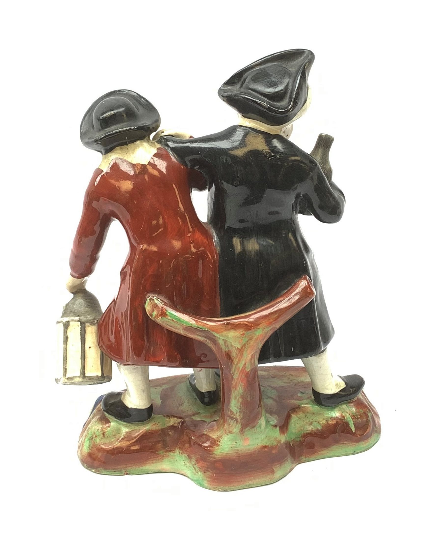A 19th century Staffordshire figure group, 'Town Crier and Drunk', upon oval scroll detailed base, H - Image 2 of 8