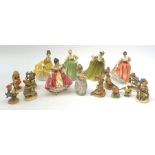 A group of figurines, comprising five Royal Doulton examples, Southern Belle HN2229, Simone HN2378,