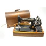 A Singer sewing machine, serial number Y9629162, in oak case with carry handle and key.