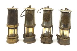 Two miners lamps, by Protector Lamp & Lighting, Eccles, together with two further unmarked examples.