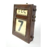 A mahogany cased perpetual wall calendar, with label detailed Fairfield S & E Company Limited Govan,