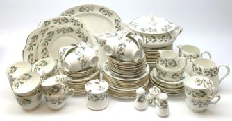 Crown Staffordshire dinner and tea wares with floral decoration upon a while ground, comprising nine