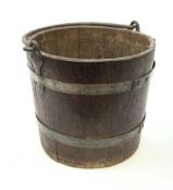 A Victorian coopered oak bucket, with swing handle, excluding handle H28cm, D33cm.
